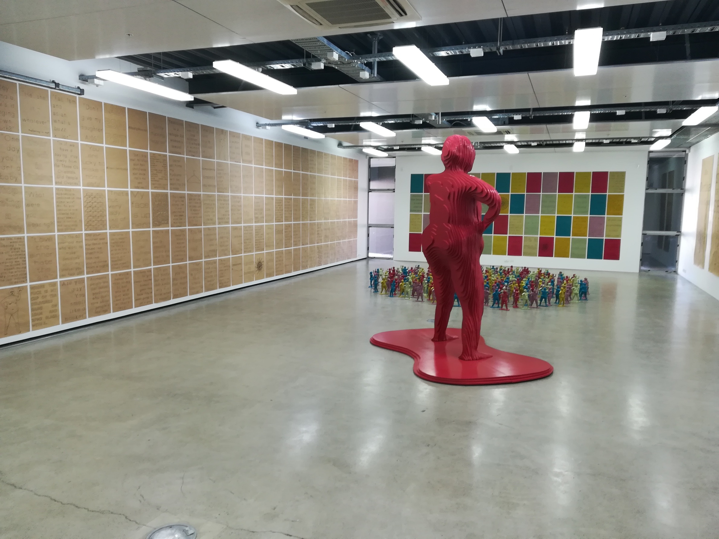 Installation shot of 300 posters, ceramic & wooden bertha