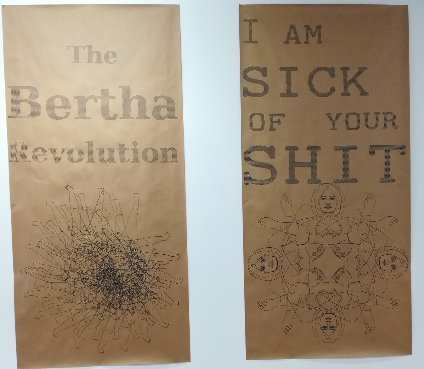 Photo of 2m tall posters that read "The Bertha revolution" and "I am sick of your shit"