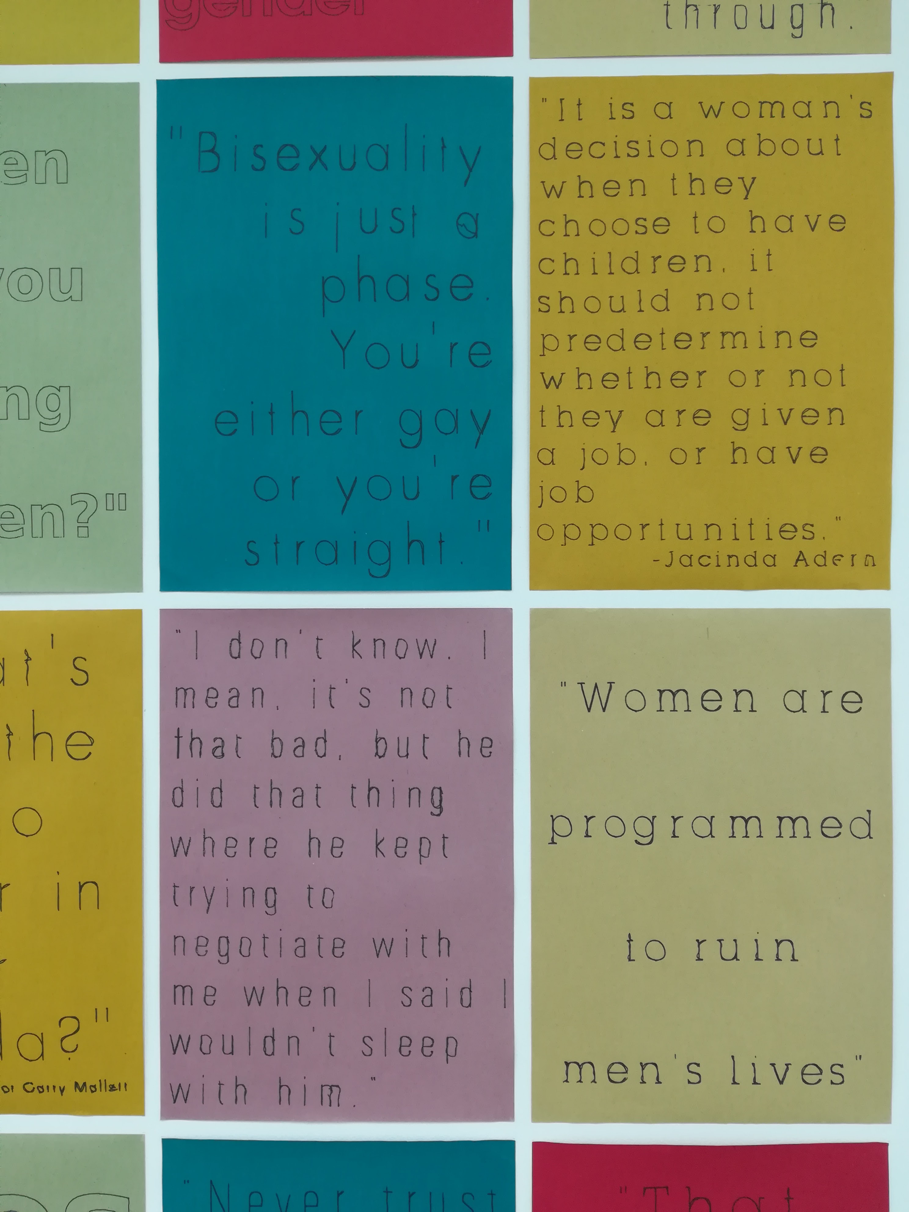 Photo of gallery wall displaying feminist posters